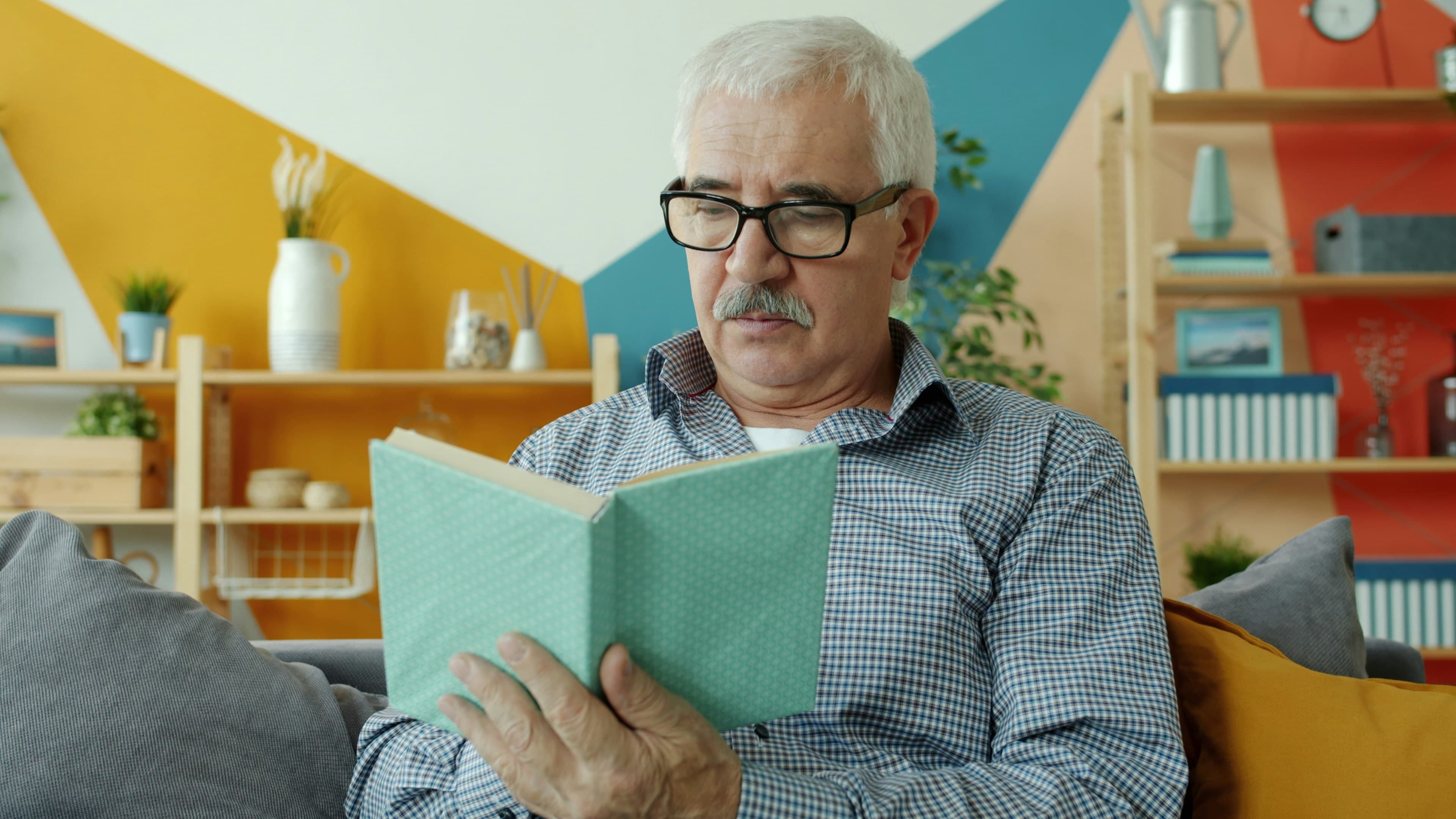 An older adult reading in a peaceful setting